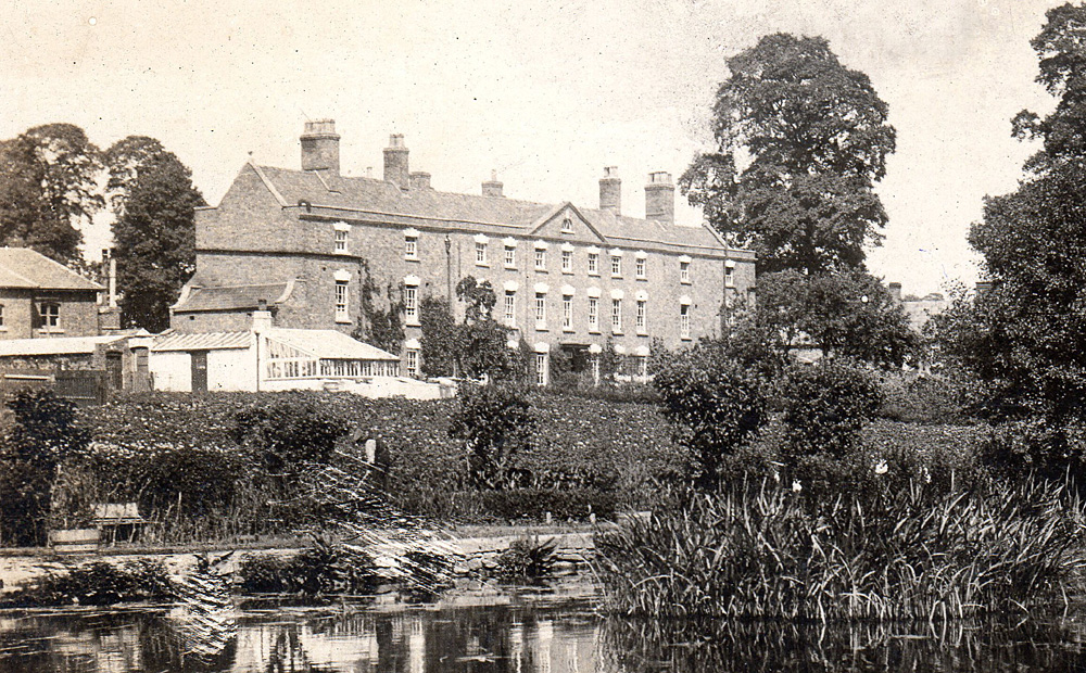 Eastington Workhouse viewed from the towpath.