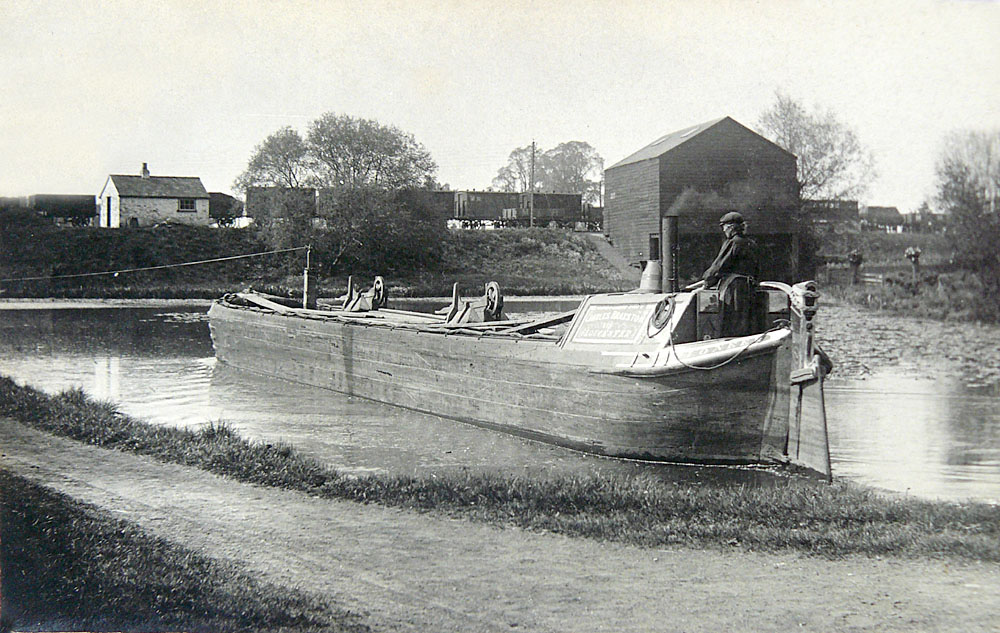 Boat passing the interchange warehouse (Glos Arch GPS/609/13)